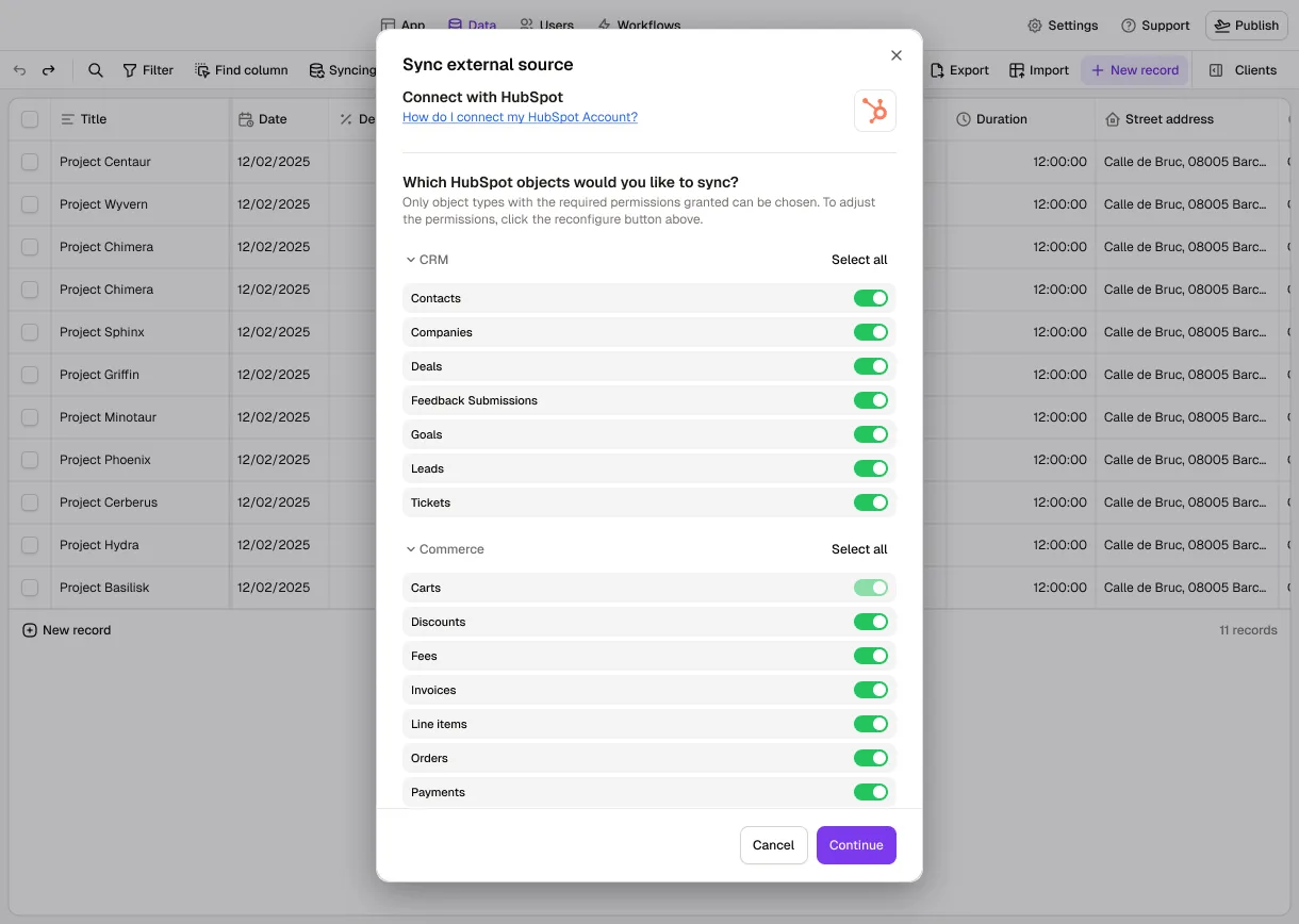 The Data tab in Rowmesh with the "Sync external source" dialog open: connected with HubSpot, choosing which HubSpot objects to sync, with CRM objects (contacts, companies, deals, tickets) and commerce objects (invoices, line items, orders, payments) switched on.
